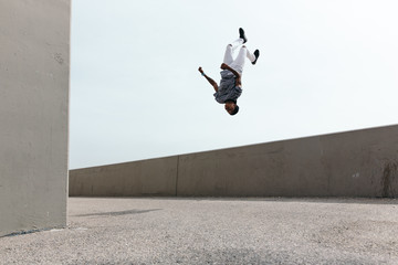 Man upside down in mid air doing backflip