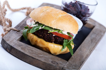 Vegetarian burger with cheese and vegetables