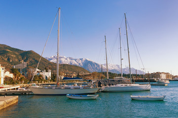 Fototapeta na wymiar Boats in the dock on a sunny day. Bay of Kotor, Tivat, Montenegro