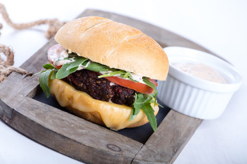 Vegetarian burger with cheese and vegetables