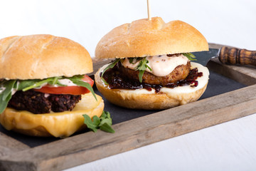 Two different fresh tasty burgers