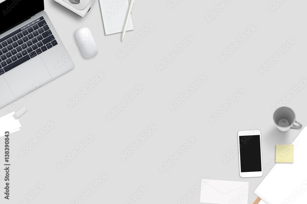 Poster computer, smart phone and stationery on gray desk. top view with free space for text.