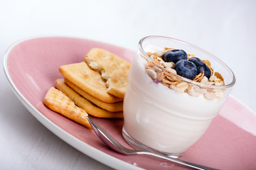 Dietetic breakfast - yoghurt with muesli and huckleberries