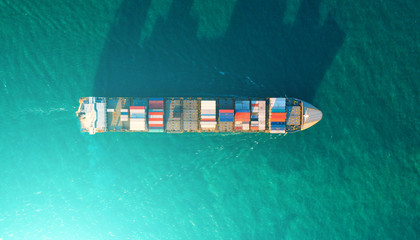 container ship in import export and business logistic.By crane ,Trade Port , Shipping.cargo to harbor.Aerial view.Top view.