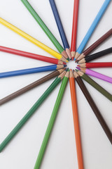 Fototapeta premium colored pencils laid out in the shape of the sun