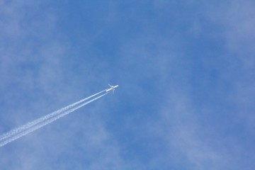 Airplane on the blue sky. 