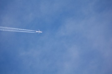 Airplane on the blue sky. 