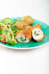 Kiev cutlet with jacket potatoes and salad