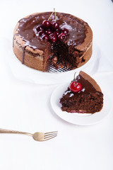 Chocolate cake with juicy cherries