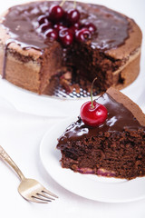 Fototapeta na wymiar Chocolate cake with juicy cherries