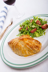 Chicken breast in french pastry with fresh salad