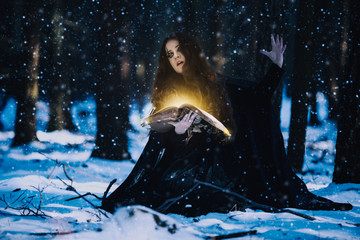 Sorceress celebrating the magic of the magic books