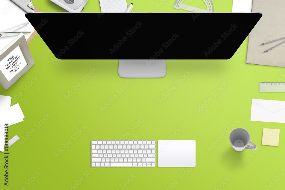 Poster computer display with blank screen for mockup surrounded with office stationery. top view with free 