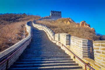 Fototapeta na wymiar BEIJING, CHINA - 29 JANUARY, 2017: Extremely steep concrete steps leading up the great wall, beautiful sunny day, located at Juyong tourist site