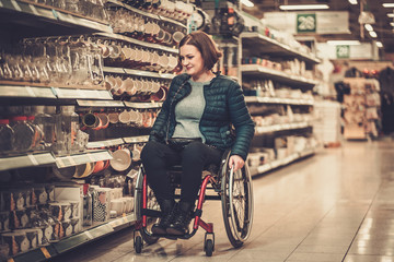 Disabled woman in a wheelchair in a department store