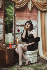 Obraz premium retro girl sitting at a dressing table
