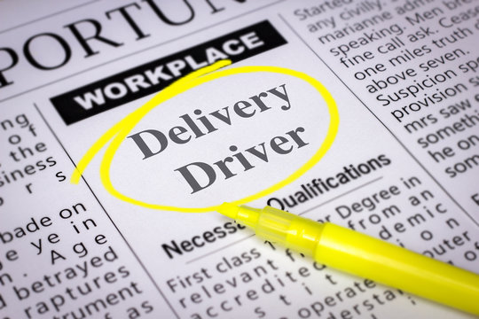 Delivery Driver - Newspaper sheet with ads and job search, circled with yellow marker, Blurred image and selective focus