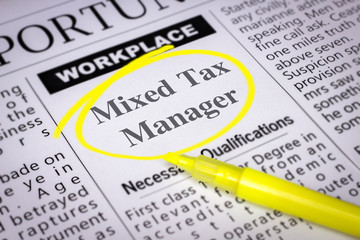 Obraz premium Mixed Tax Manager - Newspaper sheet with ads and job search, circled with yellow marker, Blurred image and selective focus