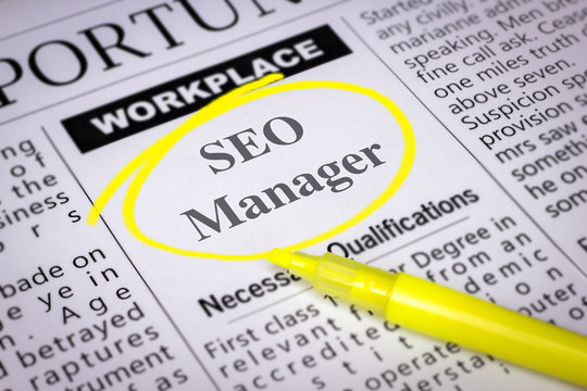 SEO Manager - Newspaper sheet with ads and job search, circled with yellow marker, Blurred image and selective focus