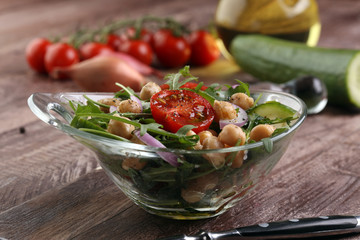 Healthy homemade chickpea and veggies salad, arugula, diet, vegetarian, vegan food, vitamin snack