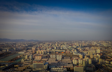 BEIJING, CHINA - 29 JANUARY, 2017: Incredible views over capitol city from top of old CCTV tower, buildings visible as far as you can see, nice blue sky