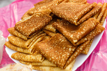 delicious pancakes in a stack with melting butter and maple syrup