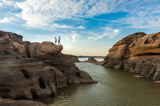 lovers standing on cliff in Thailand grand canyon (sam pan bok) at Ubon Ratchathani, Thailand