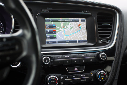 gps with the route on the dashboard of a car