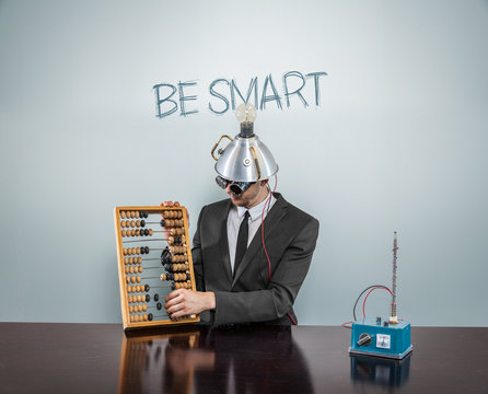Be Smart text on blackboard with businessman