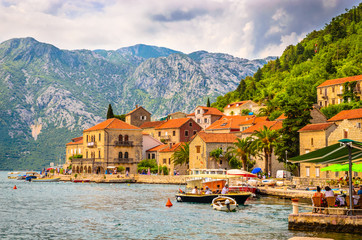 beautiful mediterranean landscape. Mountains and fishing boats near town Perast, Kotor bay (Boka Kotorska), Montenegro.