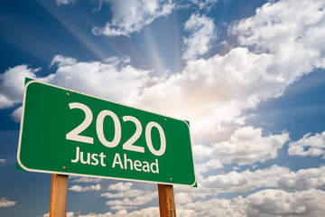2020 Green Road Sign Over Dramatic Clouds and Sky.