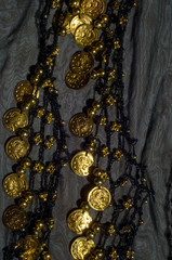 Silk fabric texture, blue, gold coins. Oriental style