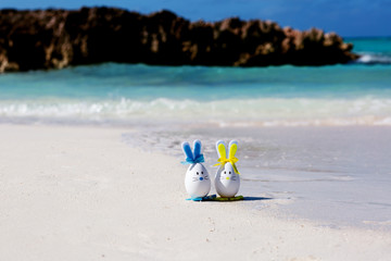 Easter, estereggs on the beach, sand, ocean, sea