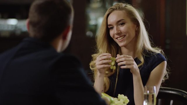 young couple drinking champagne in restaurant