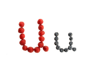 Alphabet from fresh fruit, raspberry and blackberry