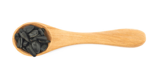 Spoon full of sunflower seeds isolated