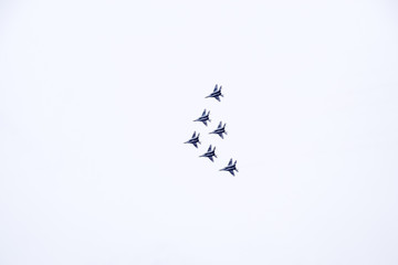 Air show in the sky above the Krasnodar airport flight school. Airshow in honor of Defender of the...