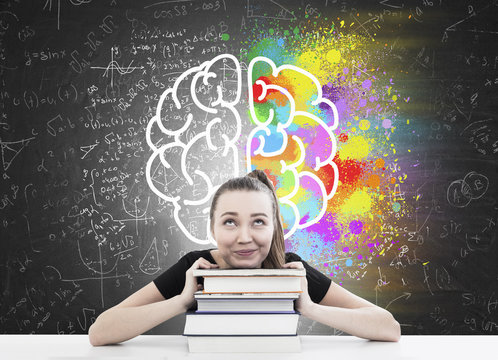 Woman with ponytail, books and brain sketch