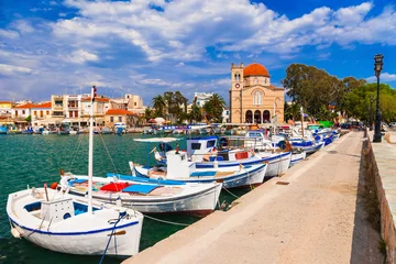 Rucksack Saronics islands of Greece .Authentic beautiful Greek island -Aegina with traditional fishing boats and St. Nicholas Church © Freesurf