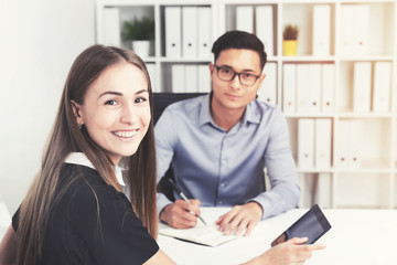 Asian businessman and his smiling colleague