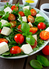 Vegetarian salad with cherry tomato, mozzarella and rucola