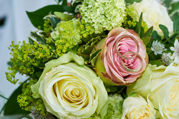 wedding bouquet with roses and rings