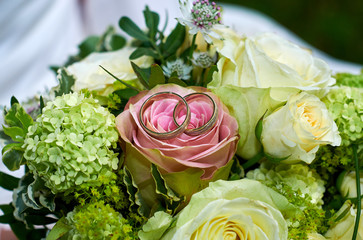 wedding bouquet with roses and rings