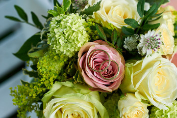 wedding bouquet with roses and rings