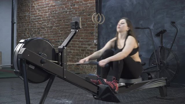 Young athletic woman training at the gym