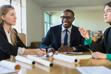 African american businessman with diverse group at a business meeting in discussion