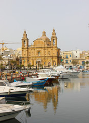 Parish Church at Msida marina with boats on Malta Island. 