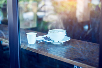 Hot coffee cup on table in cafe
