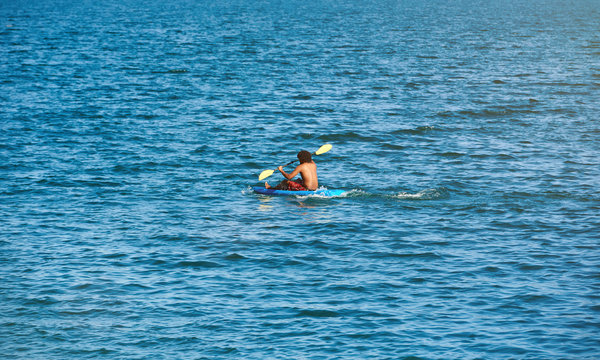 One man on blue kayak
