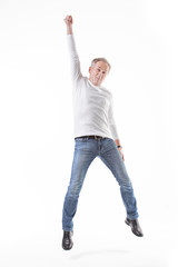 Happy senior man jumping.
